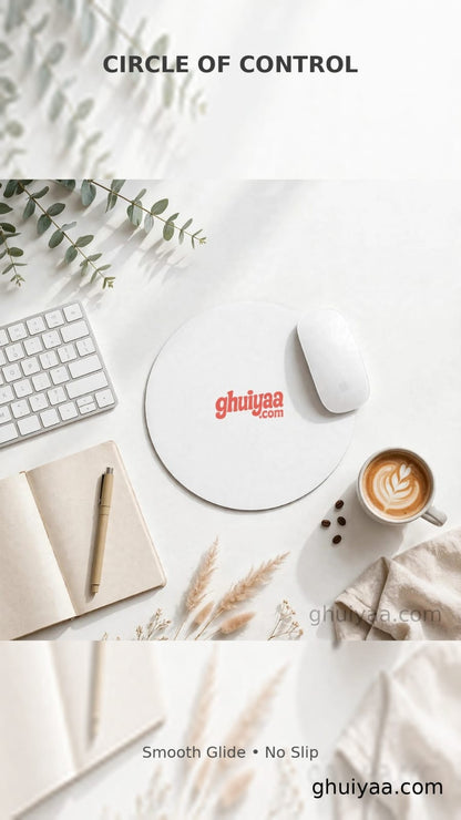 White circle mouse pad with Ghuiyaa.com logo on a minimal desk setup